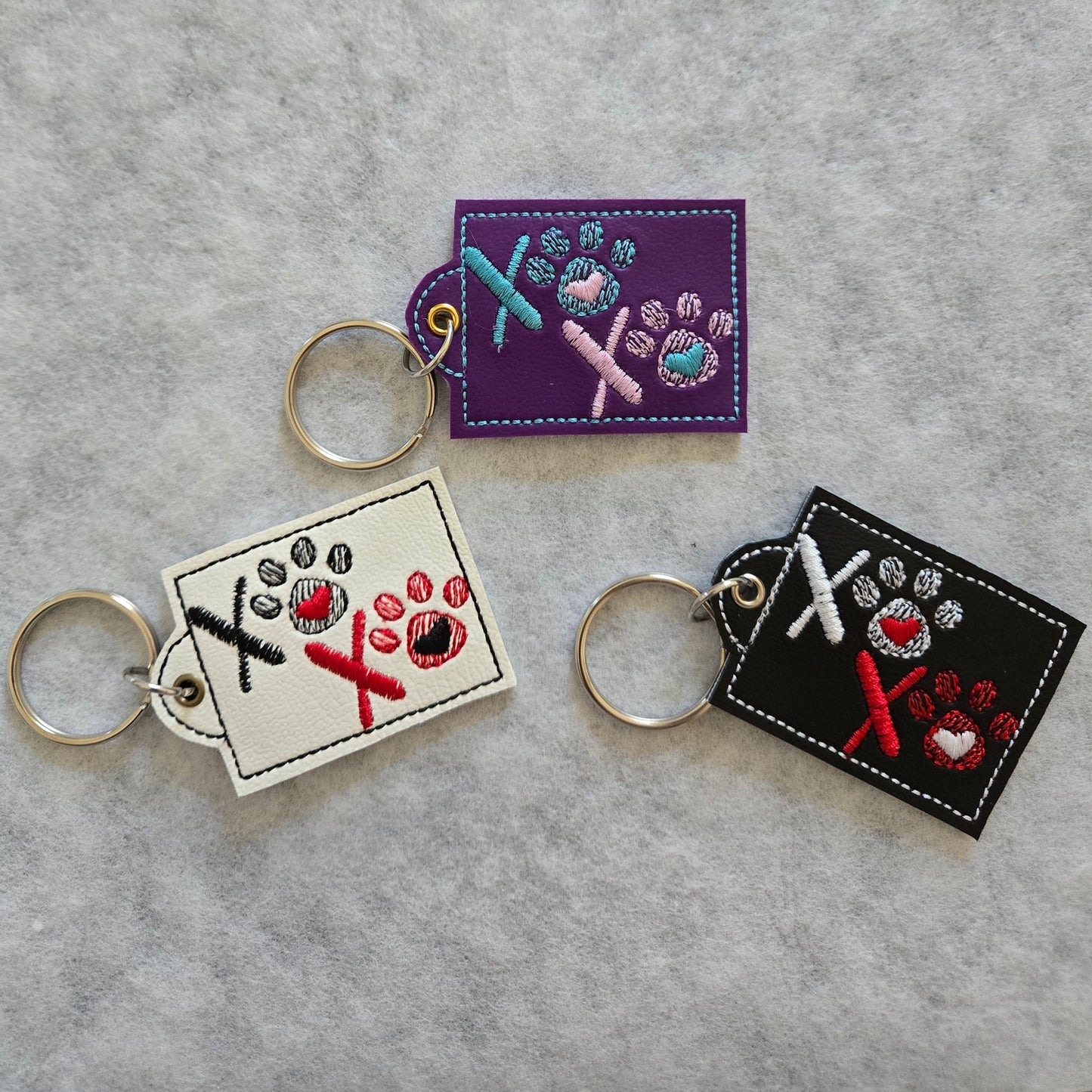 XOXO Pawprint Embroidered Vinyl Key Ring