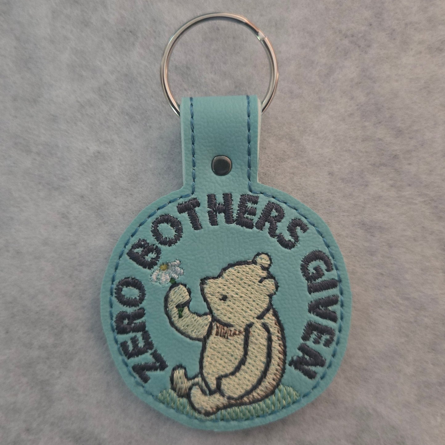 Zero Bothers Given Embroidered Vinyl Key Ring