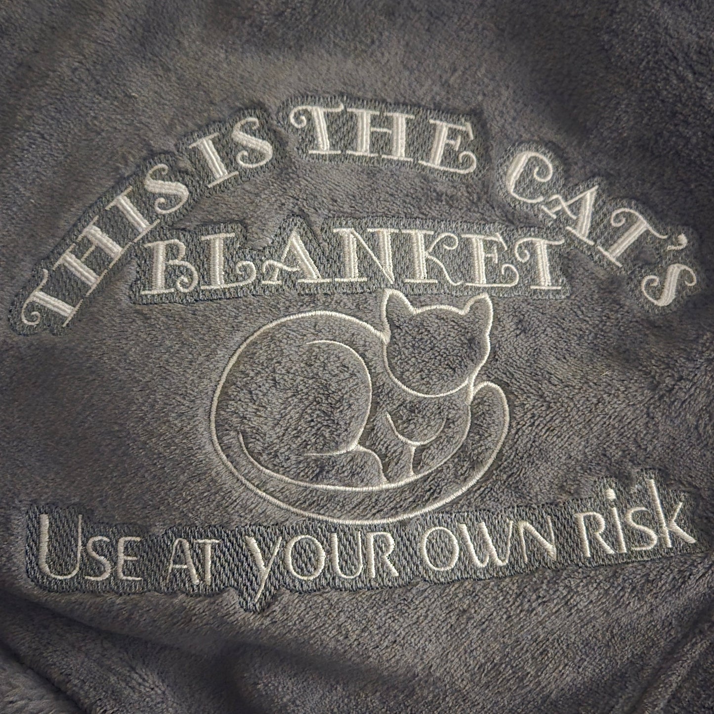 "This is the Cat's Blanket. Use at Your Own Risk" Plush Throw Blanket