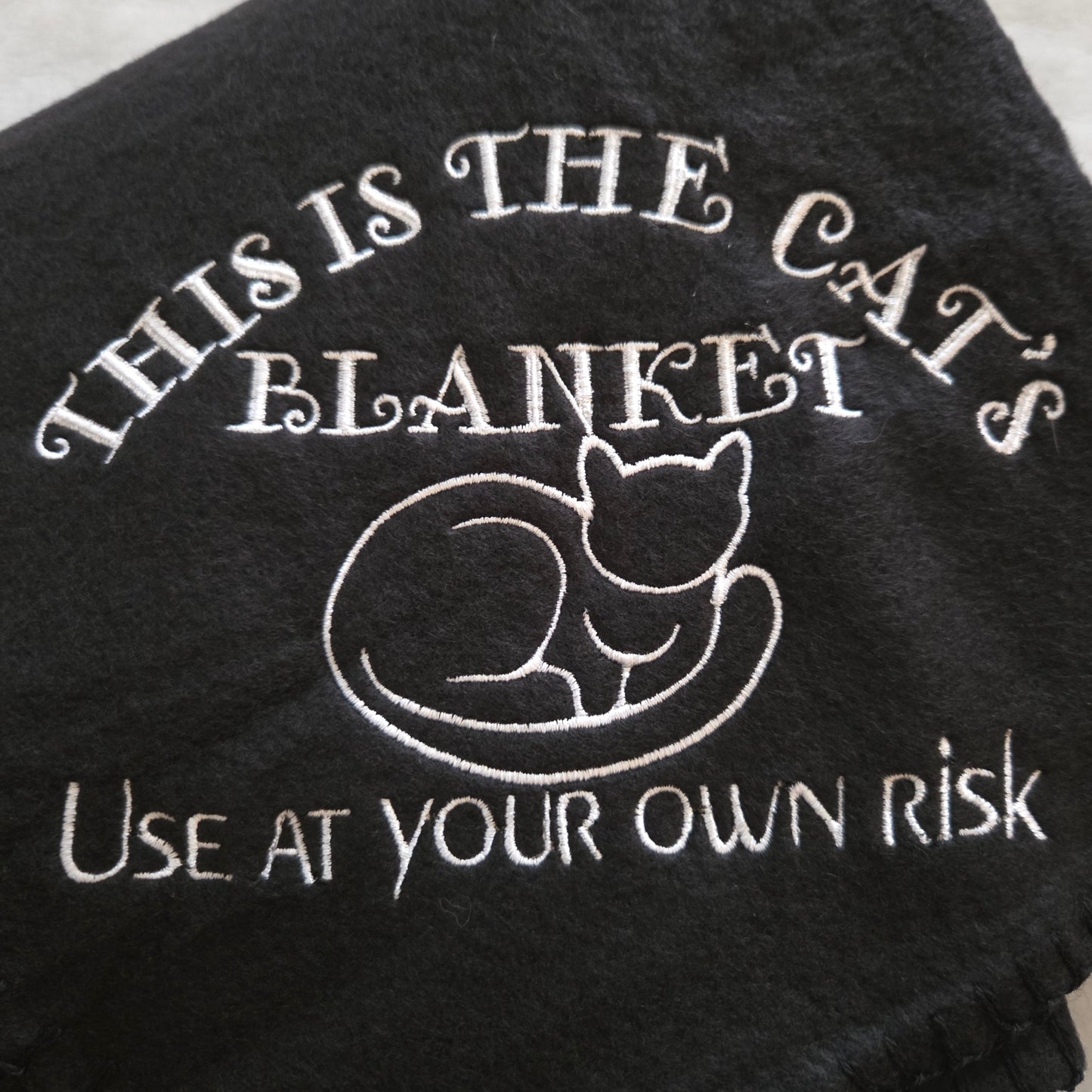 "This is the Cat's Blanket. Use at Your Own Risk" Fleece Throw Blanket