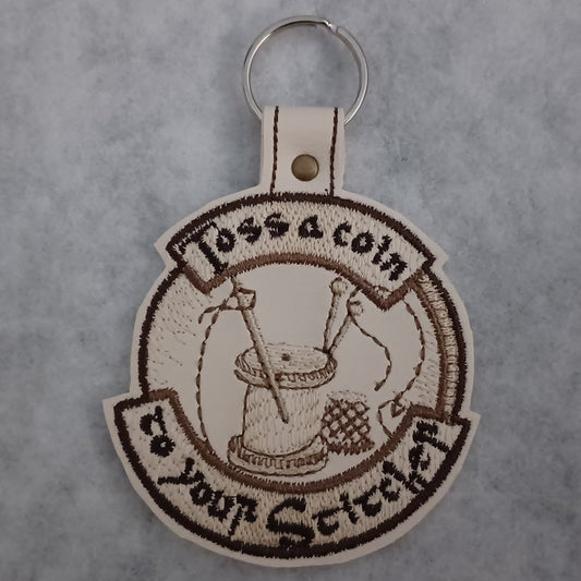 Witcher-inspired "Toss a Coin to Your Stitcher" Embroidered Vinyl Key Ring