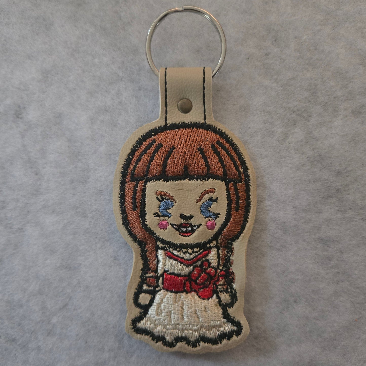 Chibi Evil Braid Doll Embroidered Vinyl Key Ring