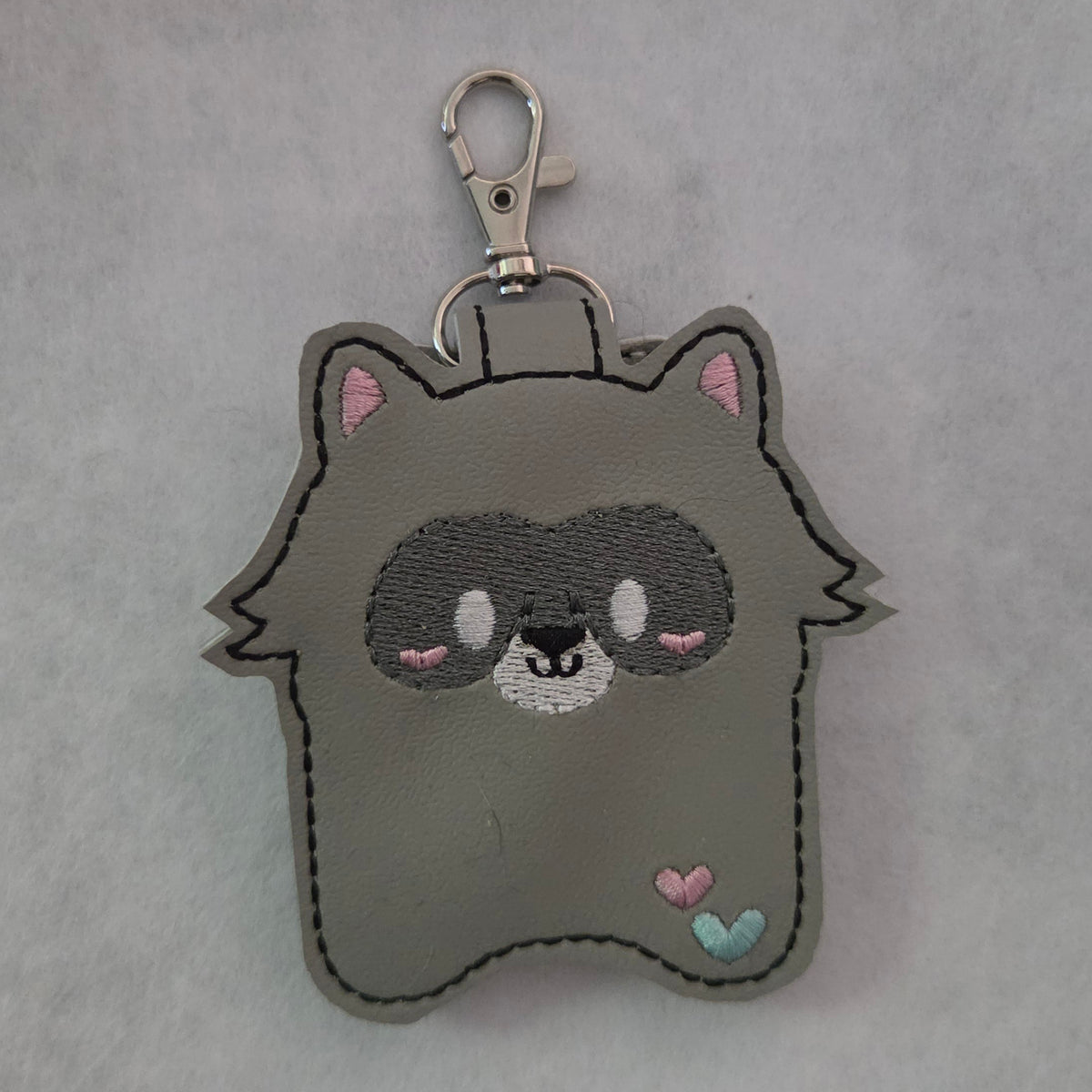Cutie Raccoon Hand Sanitizer Holder